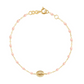 The Gigi Clozeau Madone Charm Bracelet 6.7" is an elegant piece by Gigi Clozeau, featuring delicate resin pearls, small pink beads, and an oval detail in timeless 18-carat gold to complement any ensemble beautifully.