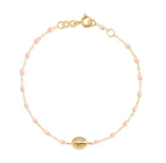 The Gigi Clozeau Madone Charm Bracelet 6.7" is an elegant piece by Gigi Clozeau, featuring delicate resin pearls, small pink beads, and an oval detail in timeless 18-carat gold to complement any ensemble beautifully.