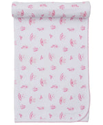 The Kissy Kissy Ready to Dance Blanket is a cozy white Pima cotton blanket with pink scalloped edges, decorated with an all-over print of pink mushrooms and small animals.