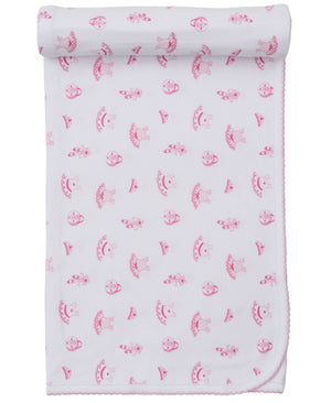 The Kissy Kissy Ready to Dance Blanket is a cozy white Pima cotton blanket with pink scalloped edges, decorated with an all-over print of pink mushrooms and small animals.