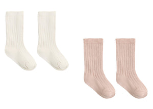 The Quincy Mae Baby Socks Set includes two pairs of ribbed baby socks—one in off-white and one in light pink—beautifully displayed on a white background and ideal as a cozy gift for little ones.