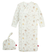 The Magnetic Me Baby Bedtime Rhymes Gown & Hat Set includes a white newborn gown with long sleeves and a coordinating knotted hat, both adorned with a pastel forest and animal print. Crafted from ultra-soft modal fabric, this set ensures gentle comfort against baby’s skin.