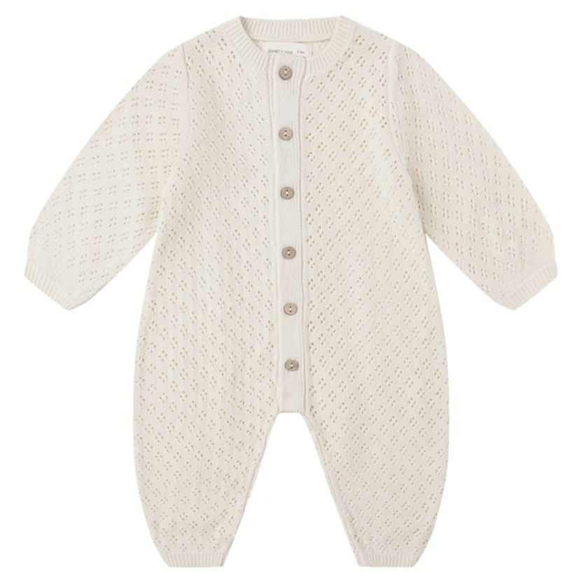 The Baby Girls' Long Sleeve Bubble Romper by Quincy Mae features a cream hue, button-down front, and textured diamond pattern in soft pointelle fabric for comfort.