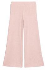 The Girls’ Salia Pants by Louise Misha are high-waisted, light pink ribbed knit pants featuring a flattering flare silhouette, shown laid flat on a white background.
