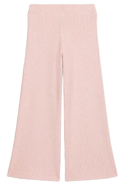 The Girls’ Salia Pants by Louise Misha are high-waisted, light pink ribbed knit pants featuring a flattering flare silhouette, shown laid flat on a white background.