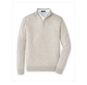 The Peter Millar Excursionist Flex Quarter-Zip Sweater in light beige Merino wool is shown layered over a collared white shirt, set against a plain white background.