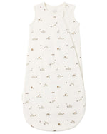 The Quincy Mae Baby Jersey Sleep Bag is made from organic brushed cotton and features a sleeveless white design with a convenient double zip side opening. It is decorated with a charming small animal and leaf print in neutral beige and brown tones.