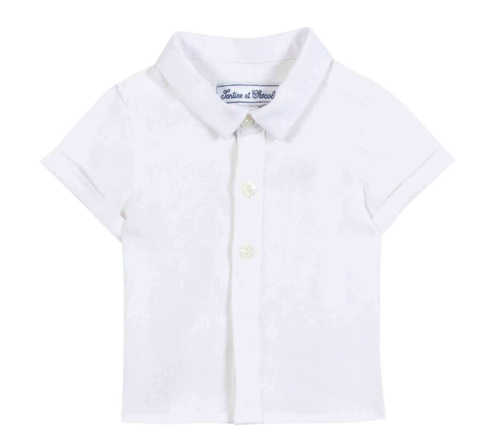 The Tartine et Chocolat Baby Boys’ and Boys’ Linen Collared Shirt, shown front-facing on a plain background, is a short-sleeve white linen shirt that offers timeless elegance for special occasions or everyday wear.