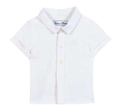 The Tartine et Chocolat Baby Boys’ and Boys’ Linen Collared Shirt, shown front-facing on a plain background, is a short-sleeve white linen shirt that offers timeless elegance for special occasions or everyday wear.
