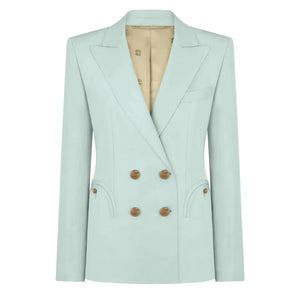 The Zenith Charmer Blazer by Blaze Milano is crafted from a silk-linen blend in light blue, featuring tan buttons, notched lapels, front pockets, and a beige lining.