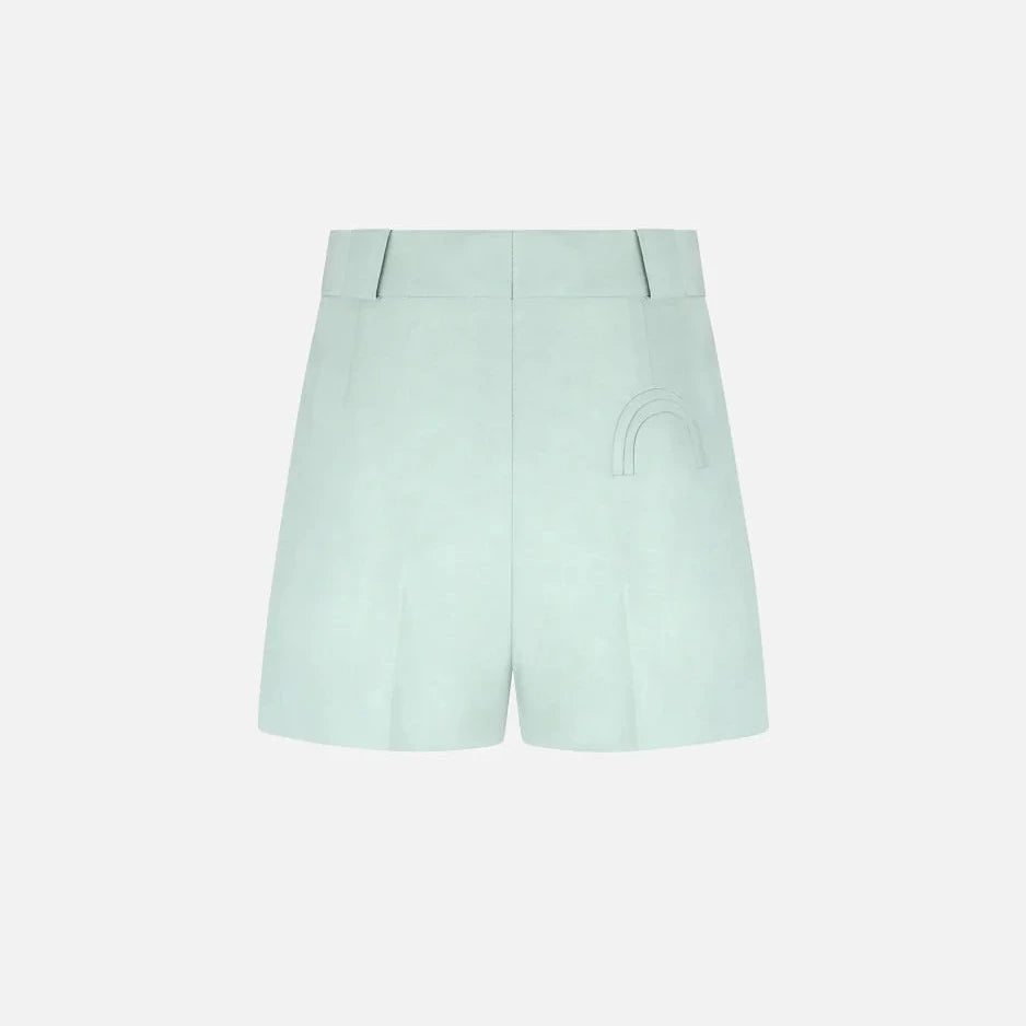 The Zenith Selle Shorts by Blaze Milano feature a light blue hue, high waist, belt loops, and a subtle stitched detail on the right side—exuding refined tailoring for your 2026 resort looks. Shown against a plain white background.