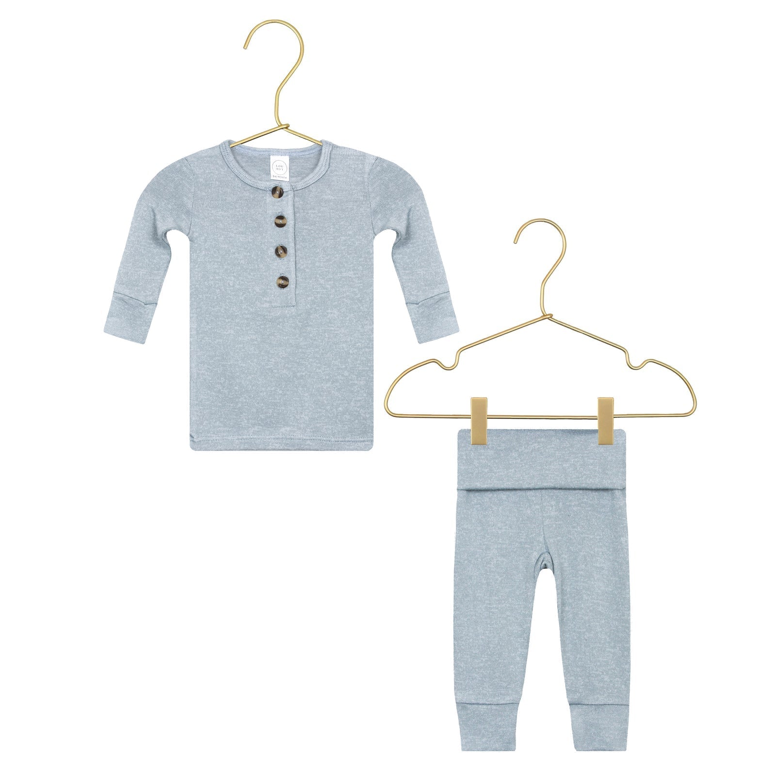 Lou Lou & Company Baby Boys’ and Boys’ Miller Plush Knit Top & Bottoms set in light blue, featuring a silky-soft fabric with long sleeves, buttons on the top, and matching pants—shown on two gold hangers against a white background.