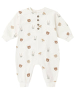 The Quincy Mae Baby Relaxed Fleece Jumpsuit is a white, long-sleeve essential adorned with brown and gray bear and bunny faces, featuring four brown buttons on the front for easy dressing—perfect for keeping your little one cozy every day.