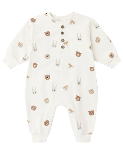 The Quincy Mae Baby Relaxed Fleece Jumpsuit is a white, long-sleeve essential adorned with brown and gray bear and bunny faces, featuring four brown buttons on the front for easy dressing—perfect for keeping your little one cozy every day.