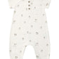 The Quincy Mae Baby Short Sleeve Jumpsuit features a white design adorned with small gray sheep patterns, a chest pocket, three coconut buttons down the front for easy changes, and elastic cuffs at the ankles.