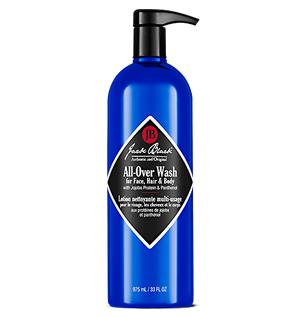 A 975 ml (33 fl oz) blue bottle of Jack Black All-Over Wash, a sulfate-free, English and French labeled face, hair, and body wash with pump dispenser.