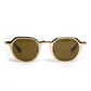The Galvan Sunglasses by Krewe feature round beige frames and dark lenses, offering a modern look. They are displayed front-facing against a plain white background.