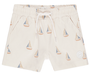 The Rylee & Cru Boys' Board Short features an elastic waistband, white drawstring, side pockets, and a blue and tan sailboat pattern—ideal for matching or coordinated swimwear looks.