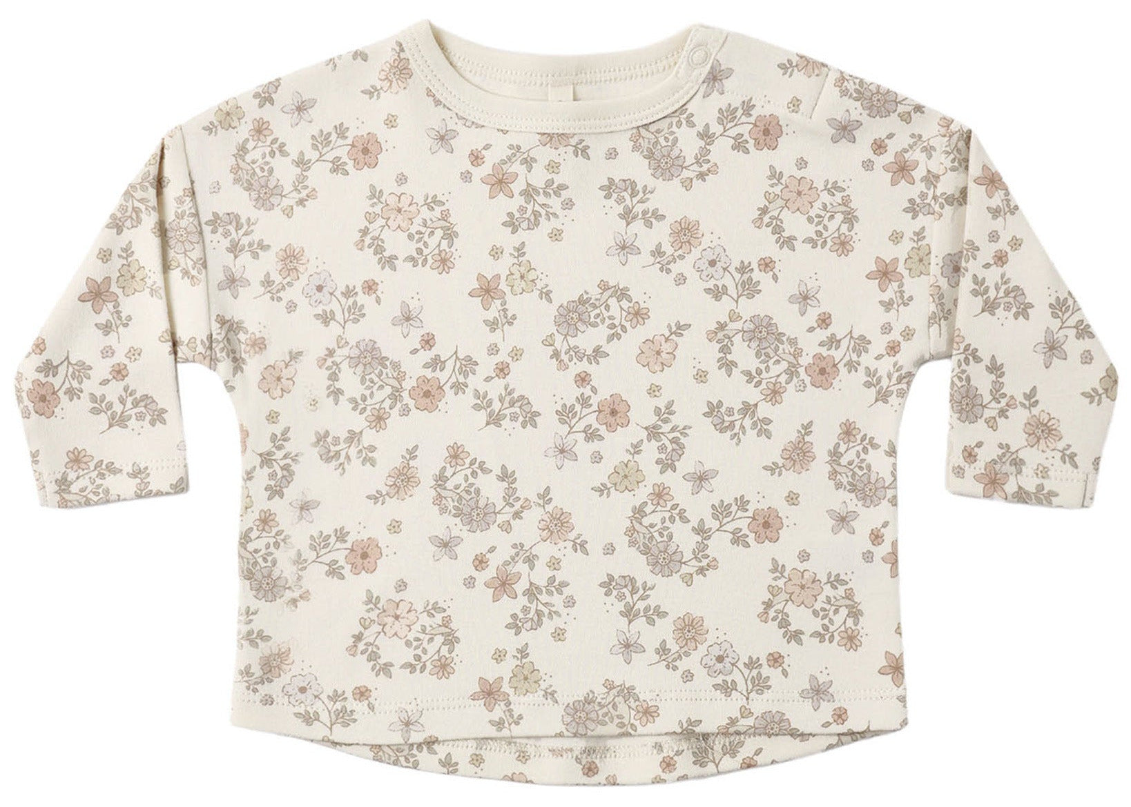 The Quincy Mae Baby and Kids’ Long Sleeve Tee features a round neckline, convenient shoulder snaps, and is crafted from soft organic brushed cotton with a delicate neutral-toned floral pattern on a cream background.
