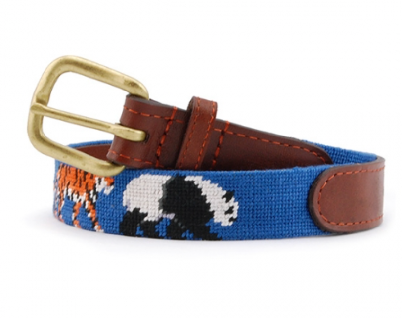 A Smathers & Branson Children's Zoo Belt with a woven panda design in white and black, featuring a brown leather trim and a brass buckle.