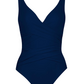 A navy blue Karla Colletto Basics Surplice Underwire Tank from Karla Colletto with a wrap design, thick shoulder straps, and moderate coverage.