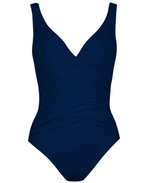 A navy blue Karla Colletto Basics Surplice Underwire Tank from Karla Colletto with a wrap design, thick shoulder straps, and moderate coverage.