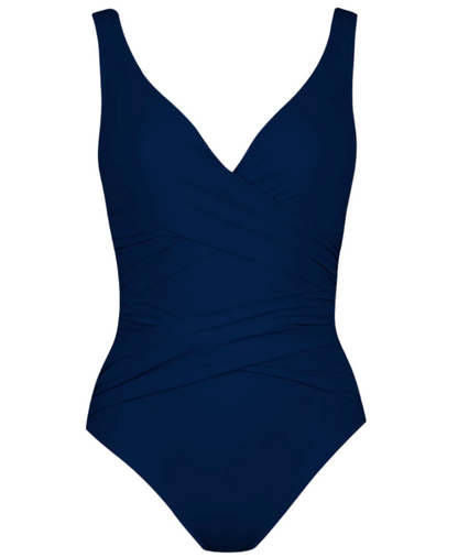 A navy blue Karla Colletto Basics Surplice Underwire Tank from Karla Colletto with a wrap design, thick shoulder straps, and moderate coverage.