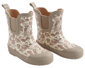 A pair of Quincy Mae Rain Boots in beige, featuring a brown floral and leaf pattern, reinforced toes, pull tabs at the back, and a comfortable rubber lining for enhanced durability.